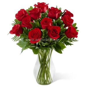 Bouquet with red roses in glass vase