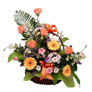 Flower arrangement in basket in earthy shades