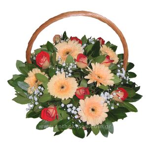 Flower arrangement in ecru-red color in a basket with handle
