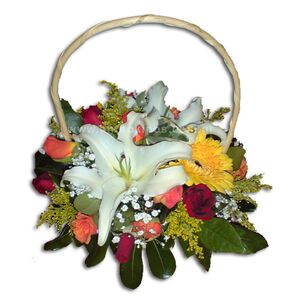 Colorful flower arrangement in basket with handle