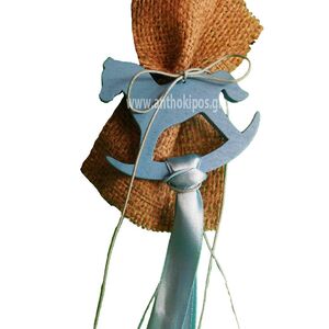 Vintage creation consisting of burlap and tied on a wooden blue horse