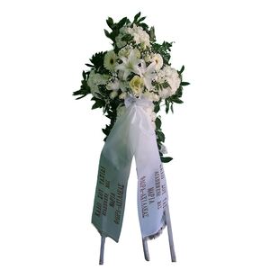 Funeral flowers cross in tripod
