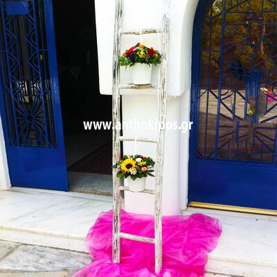 Baptism For Girl with wonderful decorative stairs and flower arrangements beautifully tied with ribbons