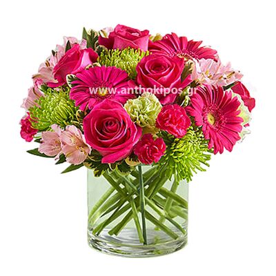Fuchsia bouquet with flowers in glass vase