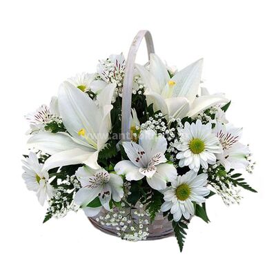 Flower arrangement in basket in white colors for funeral