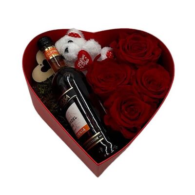 Box heart with fresh roses, teddy bear and small bottle of wine