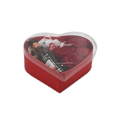 Box heart with fresh roses, teddy bear and small bottle of wine