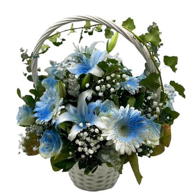 Basket with blue season flowers