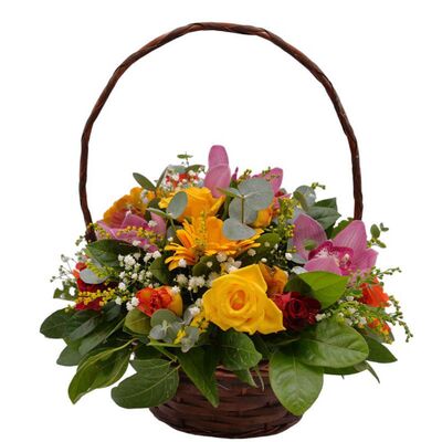 Basket with colorful season flowers
