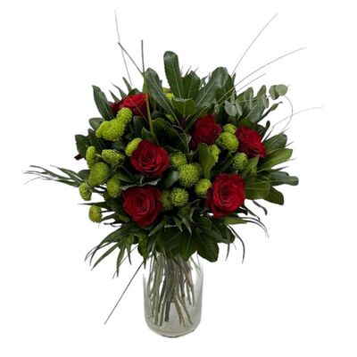 Bouquet with red roses and green chrysanthemums in glass vase