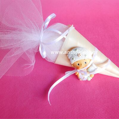 Christening bonbonniere with baby magnet on a paper cone