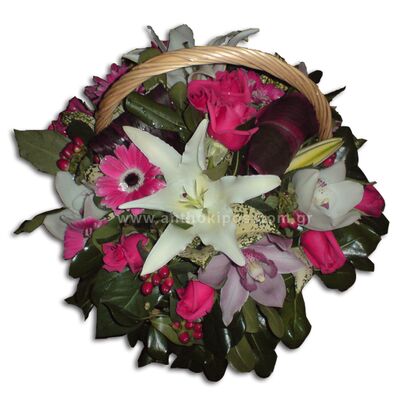 Flower arrangement in white-fuchsia shade in basket with handle