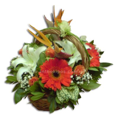 Flower arrangement in orange-white color in basket with handle