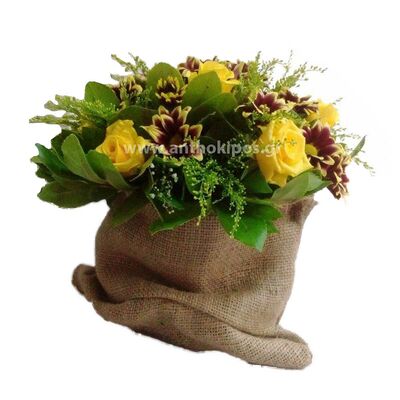 Flower arrangement in burlap sack