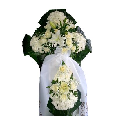 Funeral flowers cross with two arrangements