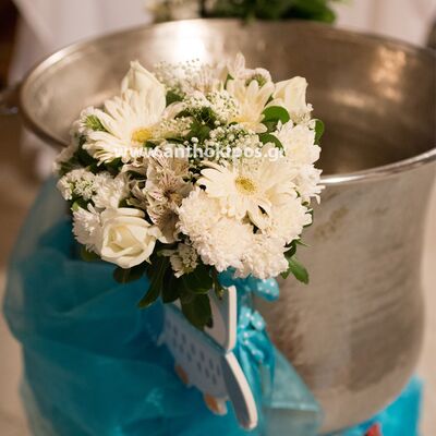 Baptism For Boy with beautiful white bouquets wrapped with fabrics