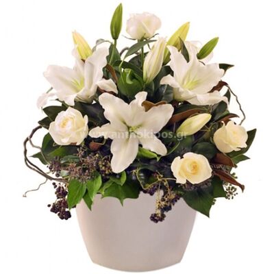 All-white flower arrangement in ceramic pot