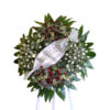 Funeral flower wreath on Tripod wheel with white roses