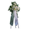 Funeral flowers cross on Tripod