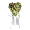 Roses on funeral flowers heart