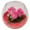 Pink roses in a glass vase with decorative pebbles