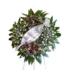 Funeral flower wreath on Tripod wheel with white roses