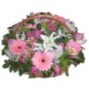 Flower arrangement in white-pink-fuchsia color in basket with handle