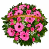 Round basket filled with pink flowers