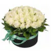 Black hat stand with white roses