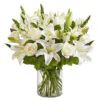 White lilies and roses in a glass vase